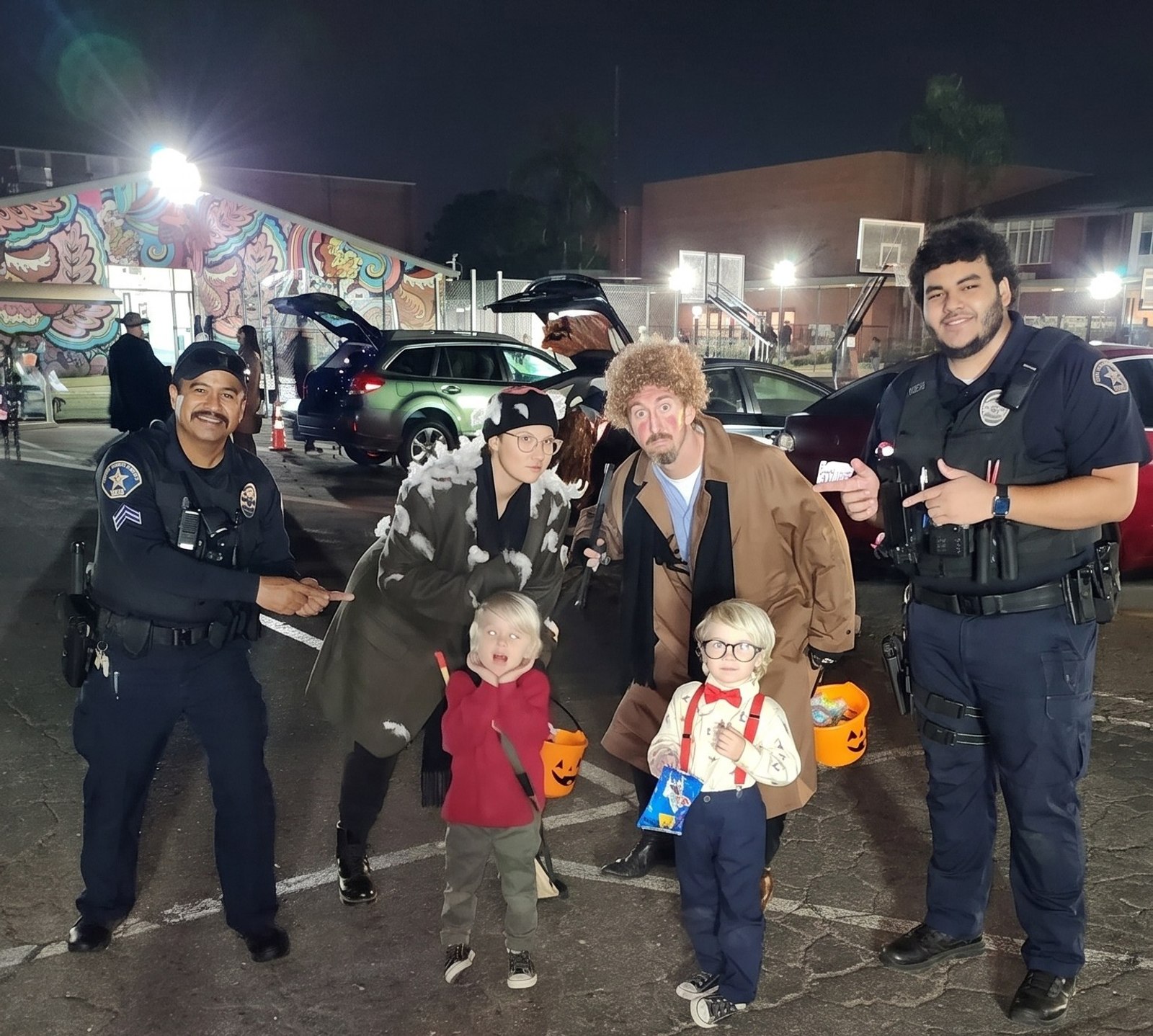 Global One Security officers with the community at a local trunk-or-treat event